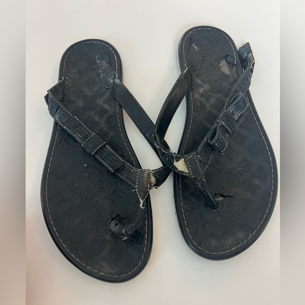Louis Vuitton Authentic monogram Panama bow flip flops. Used. Worn with love.